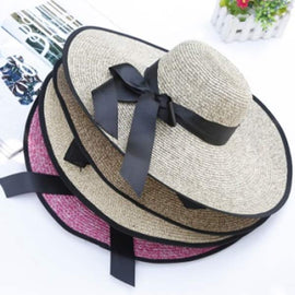 Women Hat 55% Paper, 45% Polyester With Big Black Bow On It